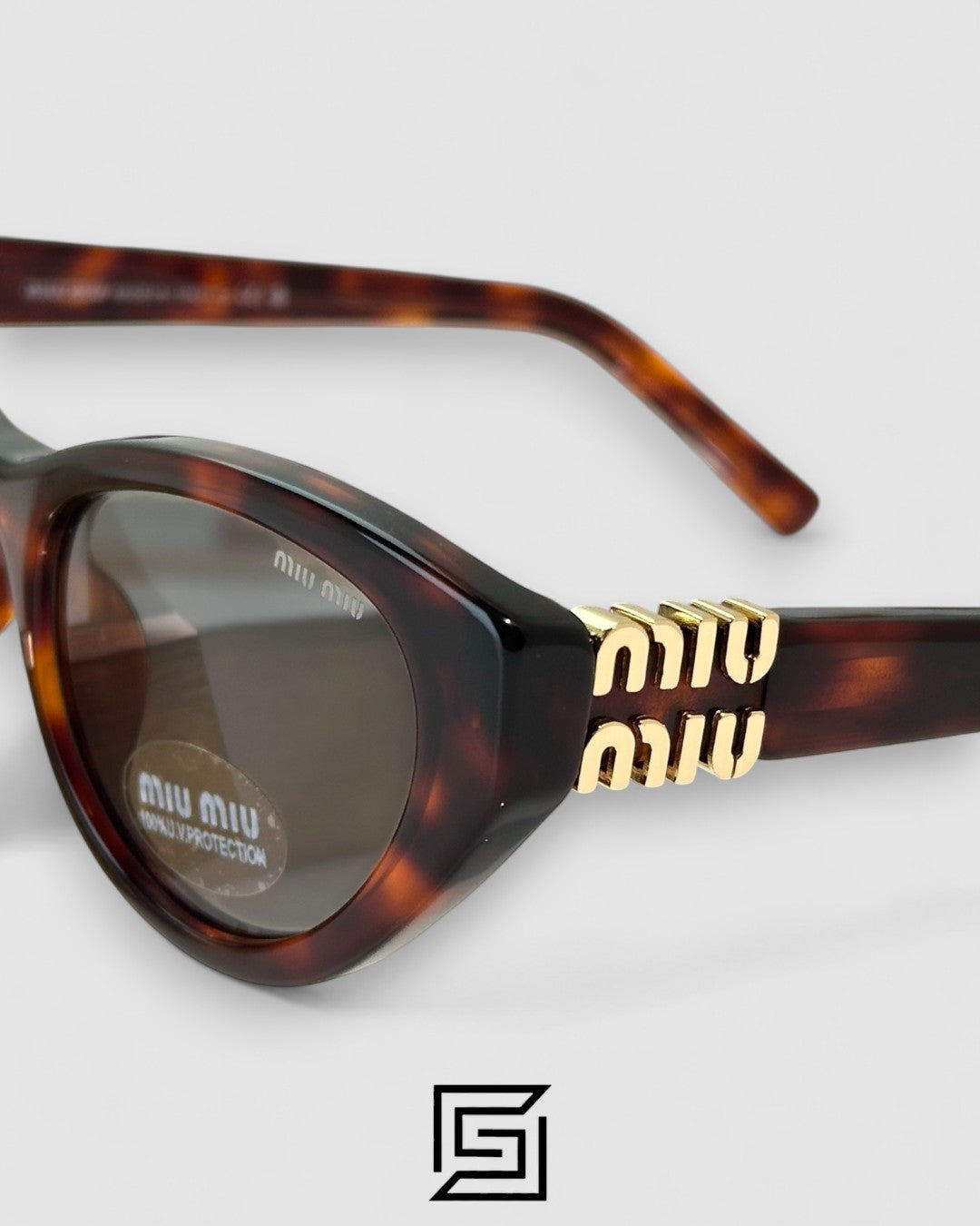 Miu Miu MUA04 21C40 عدسات رمادية فاتحة وإطار بني تايغر مع شعار ذهبي